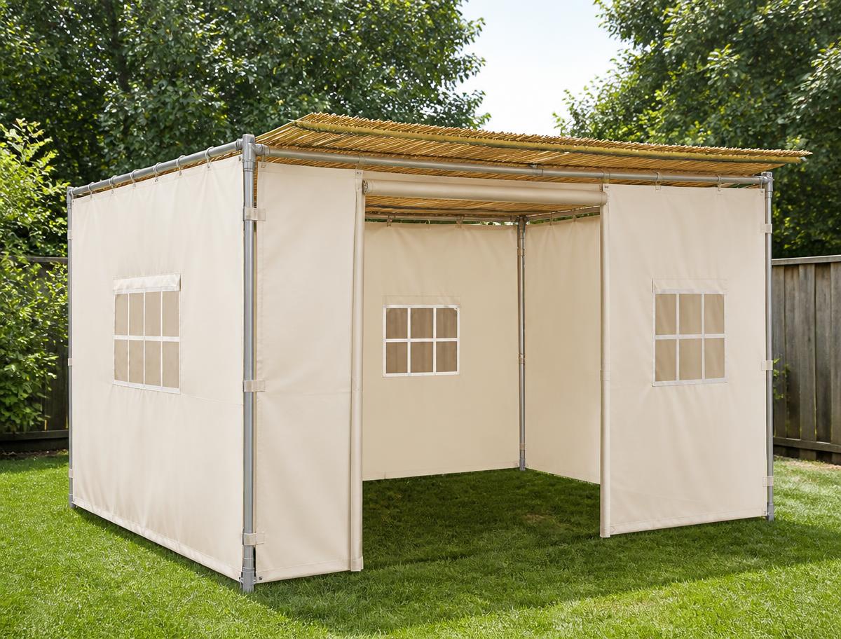 Long canvas sukkah with a full table set for family and guests